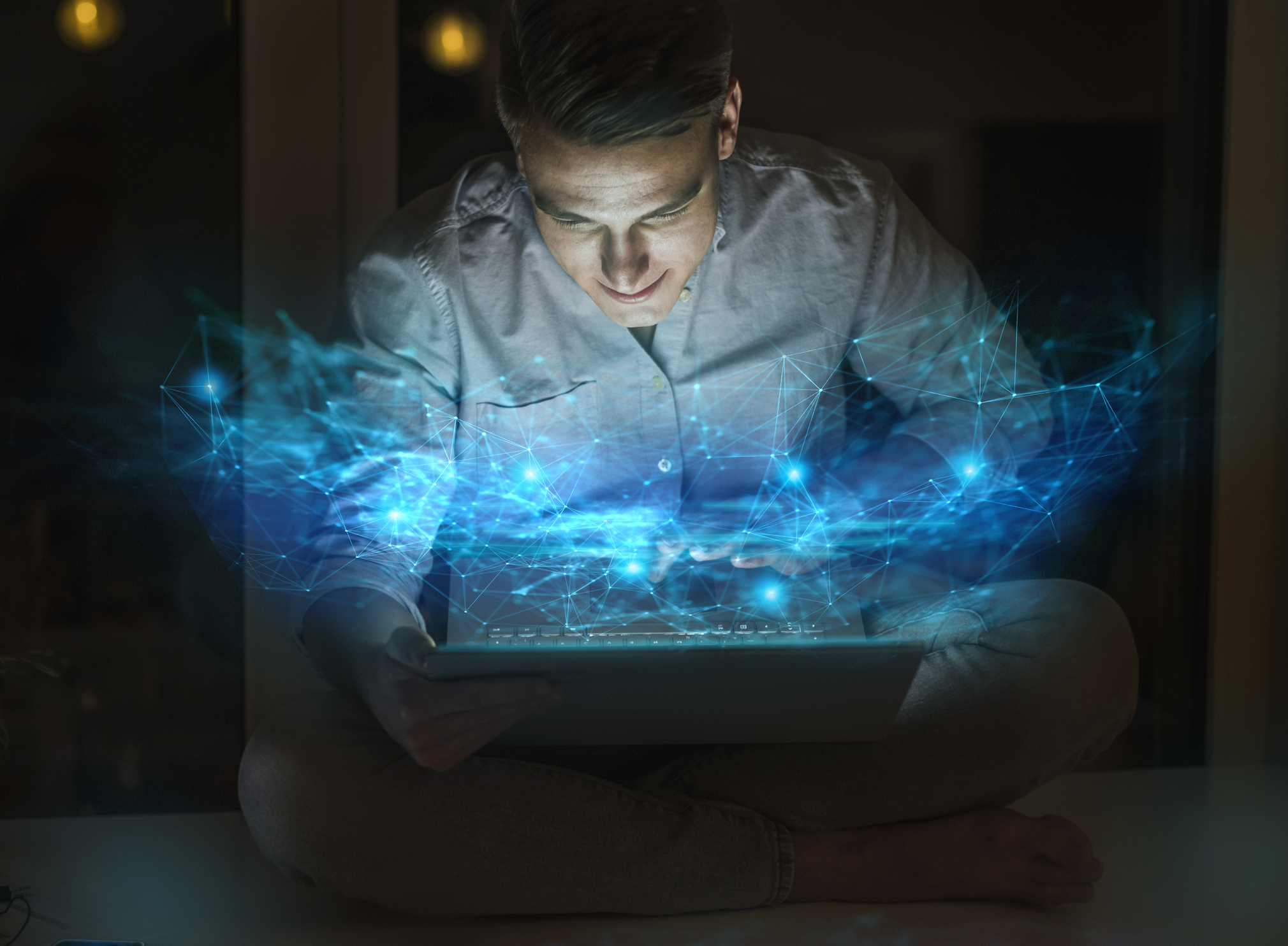 Young male professional using laptop at home office